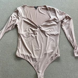 Light pale pink sparkly body suit long sleeved